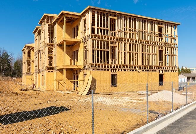 a temporary chain link fence surrounding a job site, requiring strict safety precautions in Box Elder